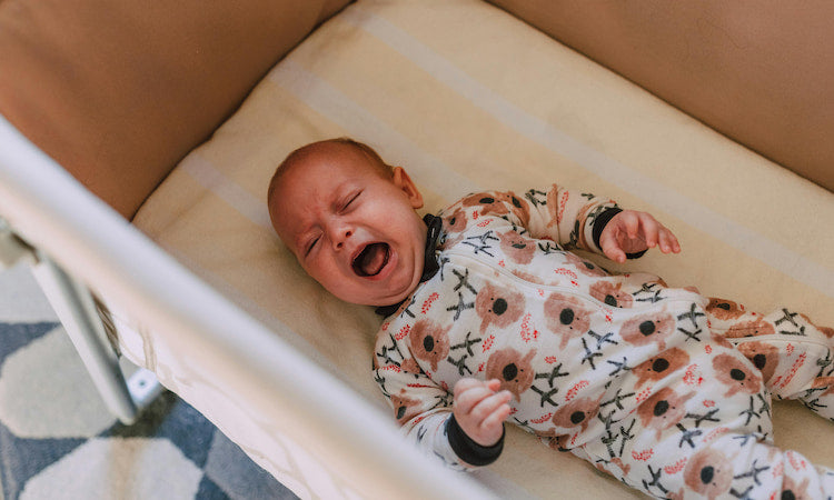 Newborn crying while sleeping