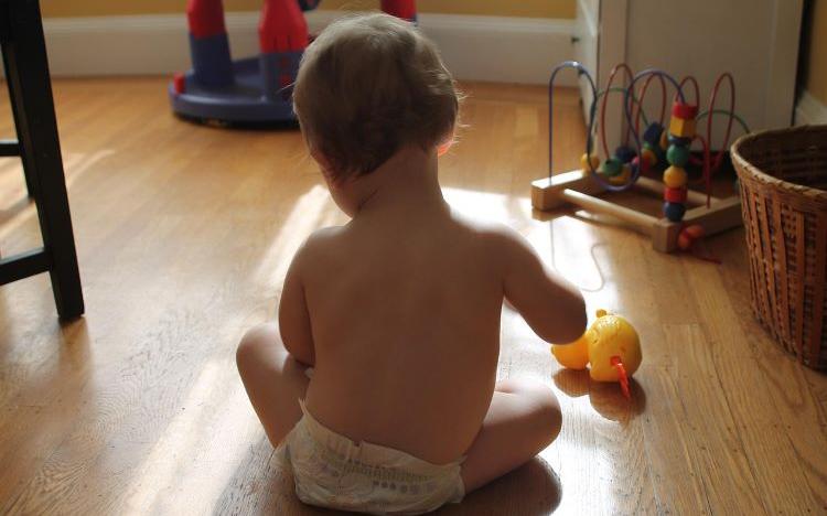 When do babies start playing with toys